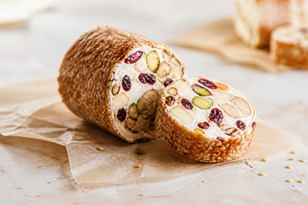 Toasted sesame coats the pistachio-cranberry nougat